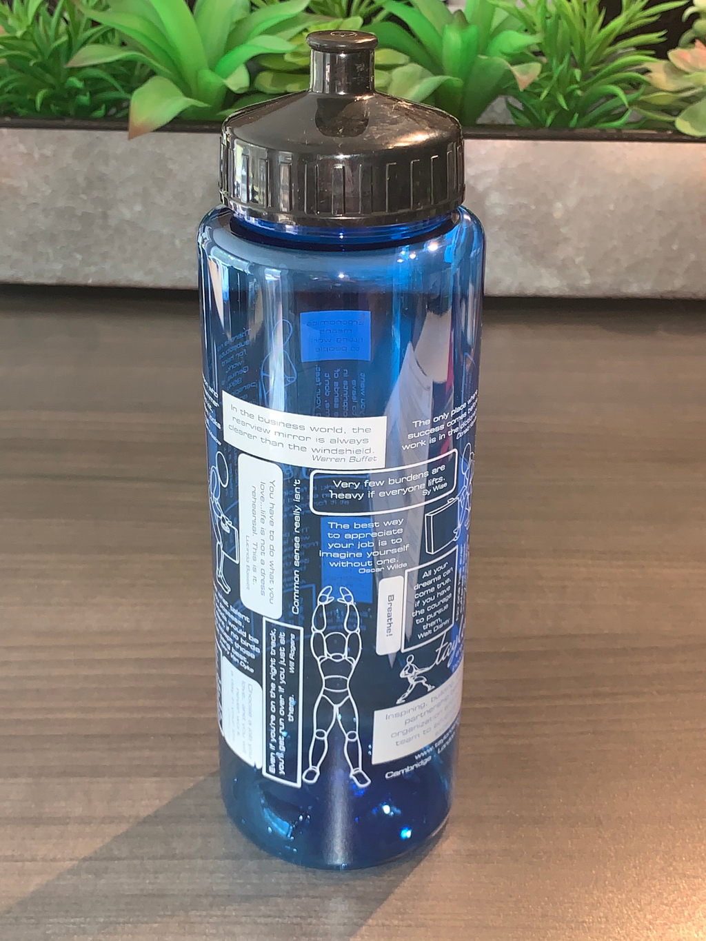extra large plastic water bottle with ergonomics tips and graphics